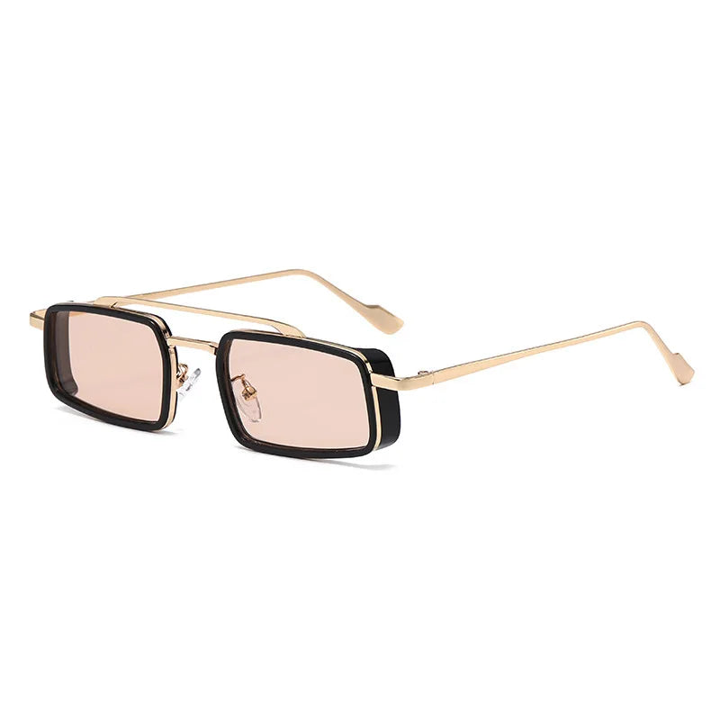 Sunglasses with gold frame and black lenses on a white background