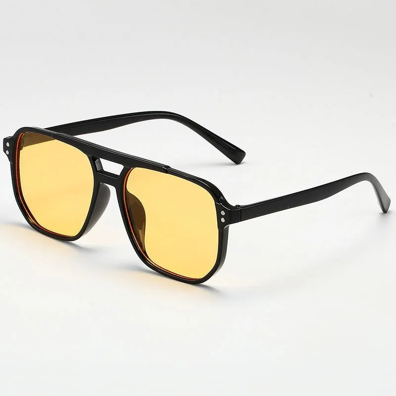 Sunglasses with black frame and yellow lenses on a white background