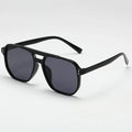 Black sunglasses with dark lenses on a white background