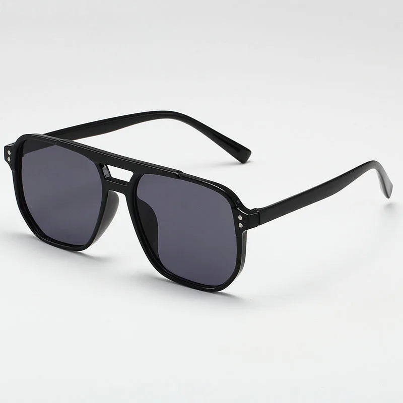 Black sunglasses with dark lenses on a white background